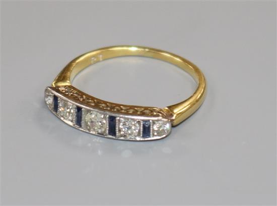 A mid 20th century 18ct gold, sapphire and diamond half hoop ring, size J.